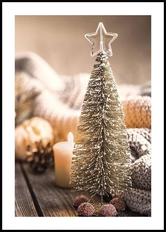 a small christmas tree sitting on top of a wooden table