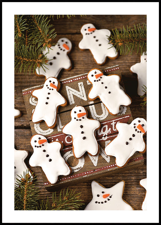 a wooden table topped with lots of decorated cookies