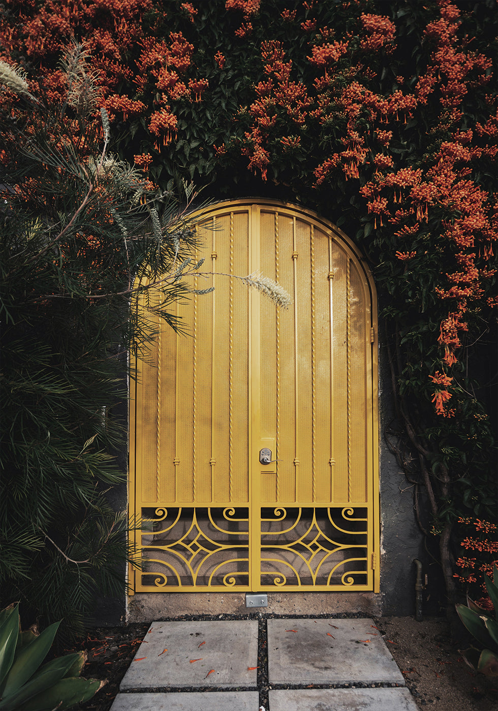 Yellow Door with Orange Flowers Poster