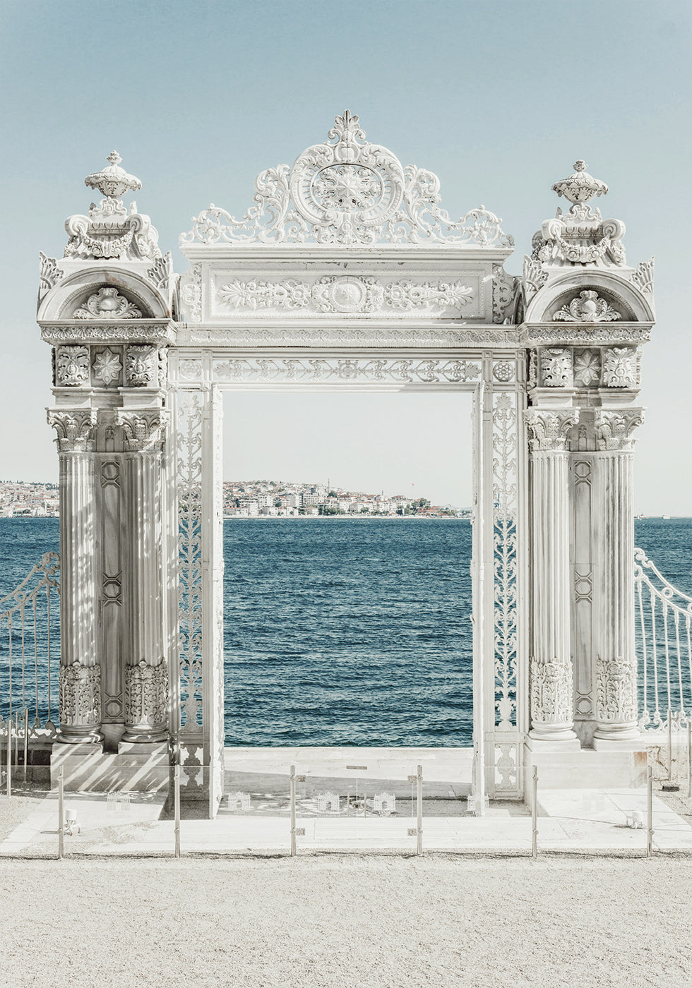 White Decorative Gate by the Sea Poster